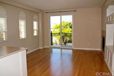 Spacious living room with wood style flooring, arc