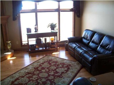 Main floor family room has fireplace, wood floors