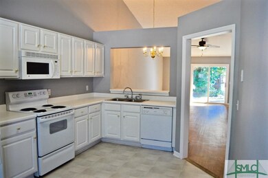 Beautiful, bright kitchen is open to living/dining