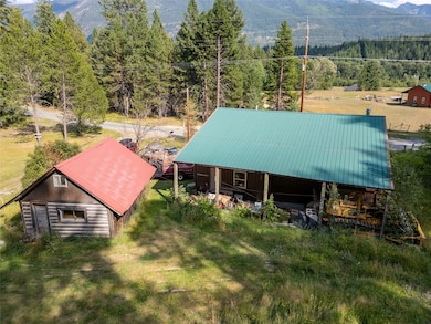 View of subject property with a mountain backdrop