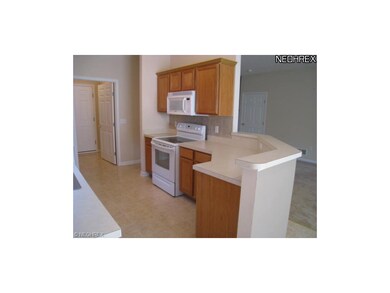 Kitchen overlooks great room and dinette.