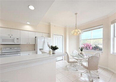 Full of natural light with windows and glass sliders across back on condo