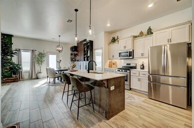 Kitchen featuring sink, light hardwood / wood-styl