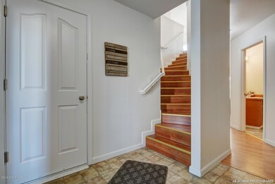 Entry with garage door and full bath