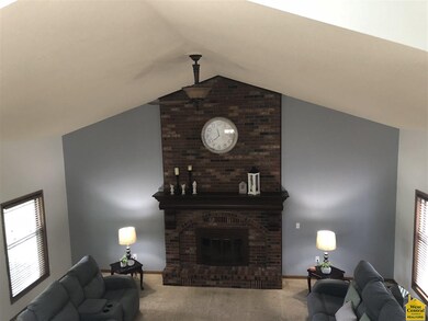 Main Family Room with Beautiful Wood Burning Brick Fireplace