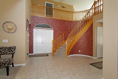 Grand entry with sweeping staircase