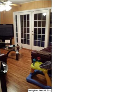 Family Room with elegant French doors that lead to