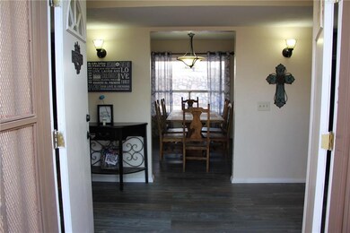 DOUBLE WIDE DOORS WITH A VIEW OF THE FOY