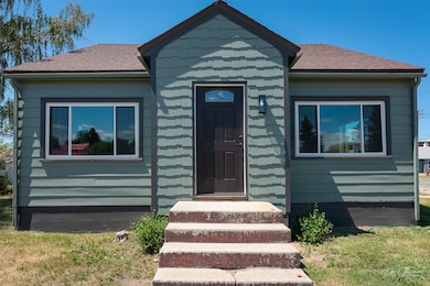 View of front of property featuring roof with shingles