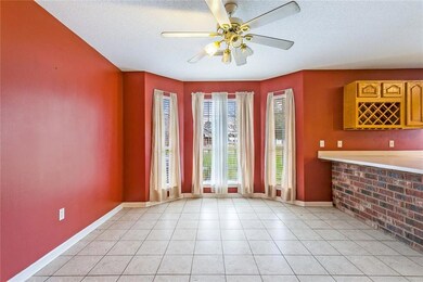 SPACIOUS DINING AREA W/FLOOR TO CEILING WINDOWS