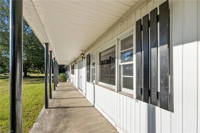 Photo showing the front porch overlooking the vast front yard.