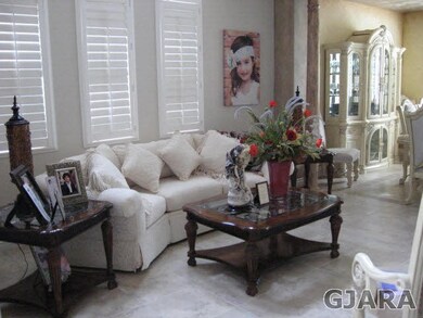 Living Room features large windows that are covere