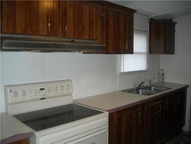 Kitchen has stove and Refrigerator
