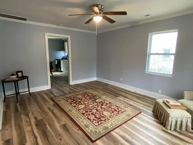 Living area featuring dark hardwood / wood-style f