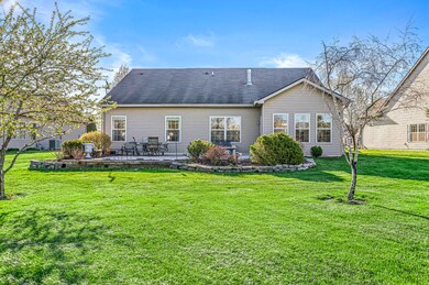Beautiful landscaping along the back of the home and patio.