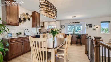 New wet bar with granite counter and wine fridge