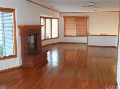 Living Room with wood burning fireplace.