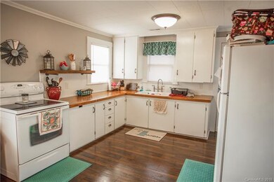 Kitchen with butcher block counter tops and access