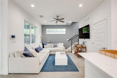 Living area with baseboards, recessed lighting, a