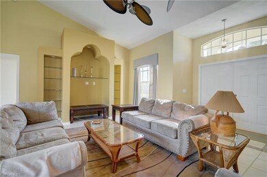 Open living area with vaulted ceiling and ceiling 