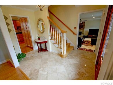 Entrance Foyer features marble flooring.
