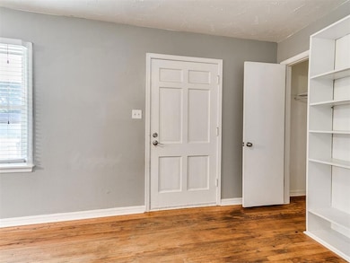 Front door, closet, and book shelf