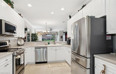 Kitchen with crown molding, light tile patterned f