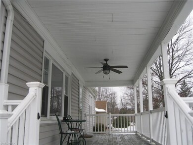 Enjoy relaxing on your large front porch....hot ch