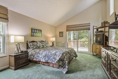 Owner's suite with cathedral ceiling and access to back deck