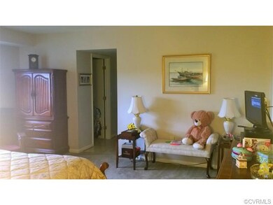 Mater suite view of one walk-in closet and hall to
