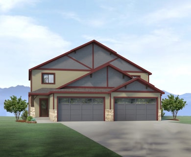 View of front of property with a garage and a front lawn