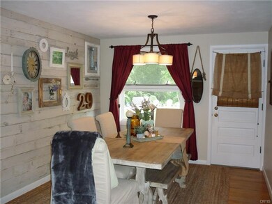 Creative washed barn-board wall in the dining room