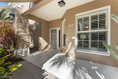 View of exterior entry featuring stucco siding