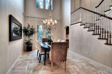 Formal living room with dramatic chandelier and tw