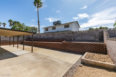 Fenced backyard featuring a patio