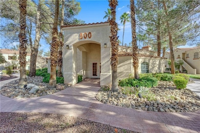 Mediterranean / spanish-style house with a tile roof and stucco siding