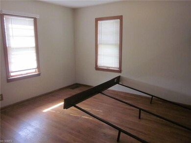 Master bedroom on first floor with hardwood floors