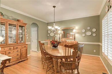 Formal Dining Room with chair railing and large picture window and room for larger dining furniture.