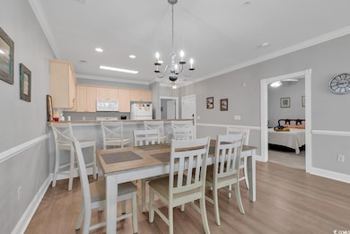 Dining area featuring an inviting chandelier, crow