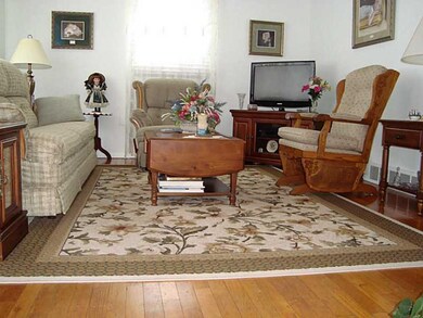 Living Room. The hardwood floors enhance this brig