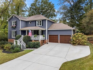 New Driveway with Parking Pad and New Garage Doors