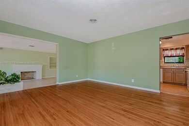 Living room showing entry to kitchen and Florida r