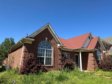 View of front of home featuring brick siding and c