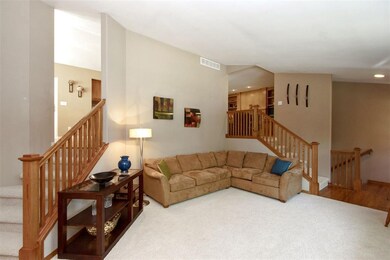 Two stairways leading to Kitchen & Hearth Room