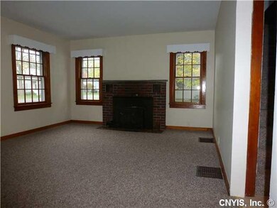 Living Room. There is a Kodiak wood burning firepl