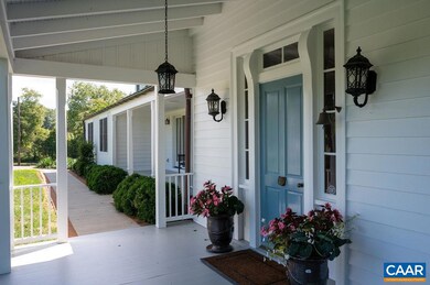 Dining room and foyer each open out onto covered p