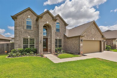Side front view, shows custom 8 ft. front door and inviting entrance.