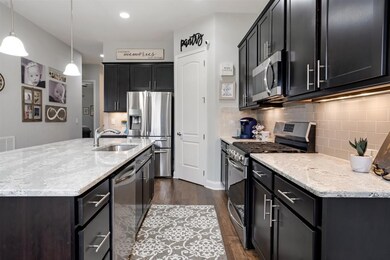 Circle flow so bring on the family or evening of entertaining.  Notice under the cabinet lighting and coffee bar next to the fridge.