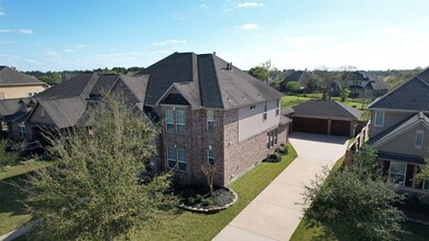 Trees, trees!  And another great view of the expansive driveway leading to the three car garage!