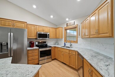 Kitchen with Granite & Stainless Steel Appliances